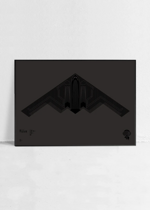 Minimalist artwork of the B-2 Spirit, featuring bold graphic lines and Morse code typography. Available in metallic silver ink or gloss varnish for a stealth effect on black Plike paper, displayed unframed in a modern home office setting.