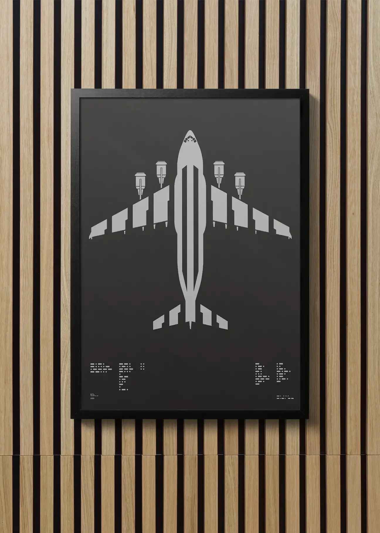 Minimalist artwork of the C-17 Globemaster II, featuring bold graphic lines and Morse code typography. Screenprinted in metallic silver ink on premium Plike paper, displayed unframed in a modern home office setting.