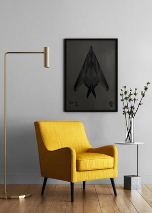 Minimalist artwork of the F-117 Nighthawk, featuring bold graphic lines and Morse code typography. Available in metallic silver ink or gloss varnish for a stealth effect on black Plike paper, displayed unframed in a modern home office setting.