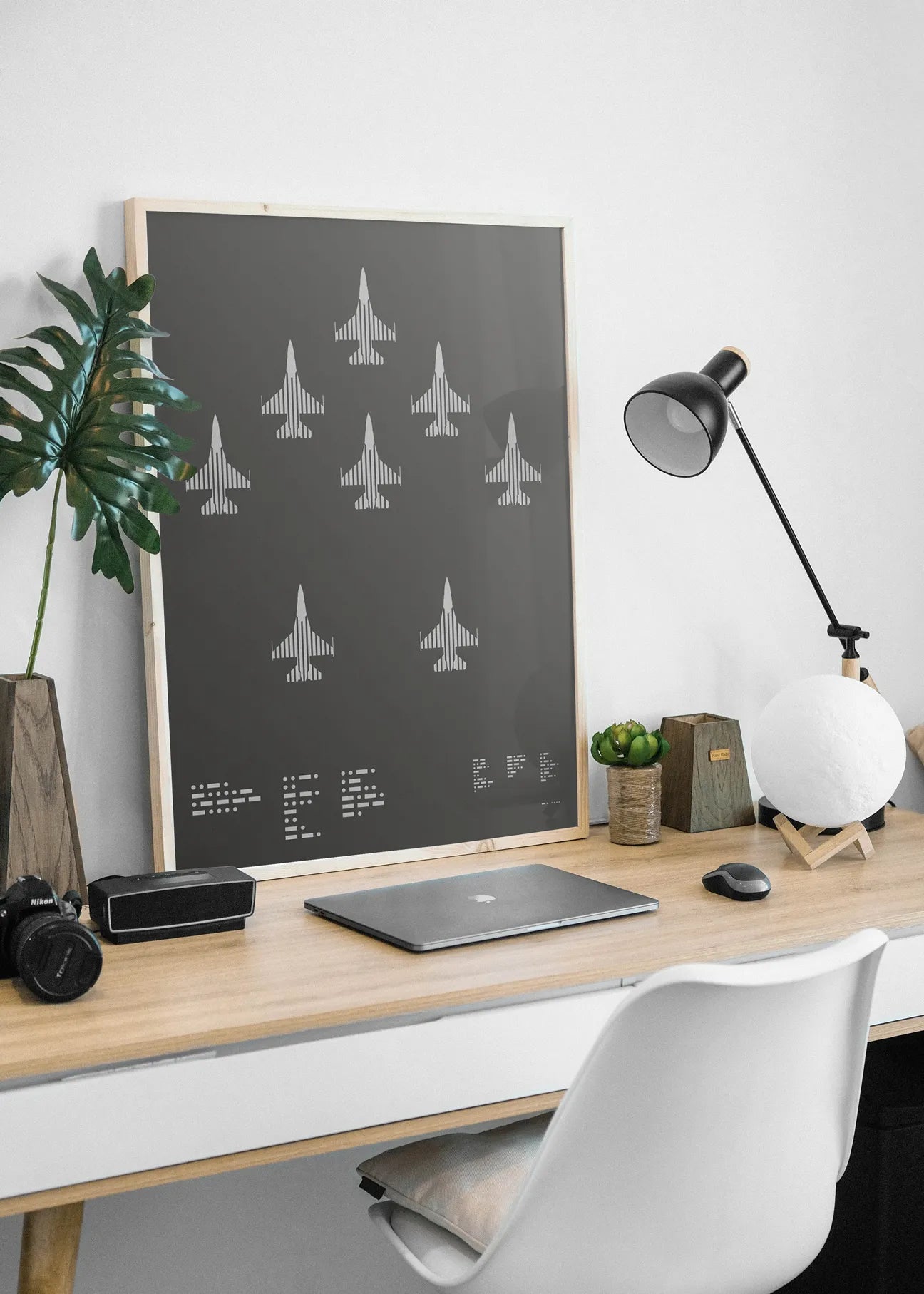 A minimalist graphic representation of the F-16 Fighting Falcon, featuring bold lines and Morse code typography, printed in metallic silver ink on premium Plike paper.