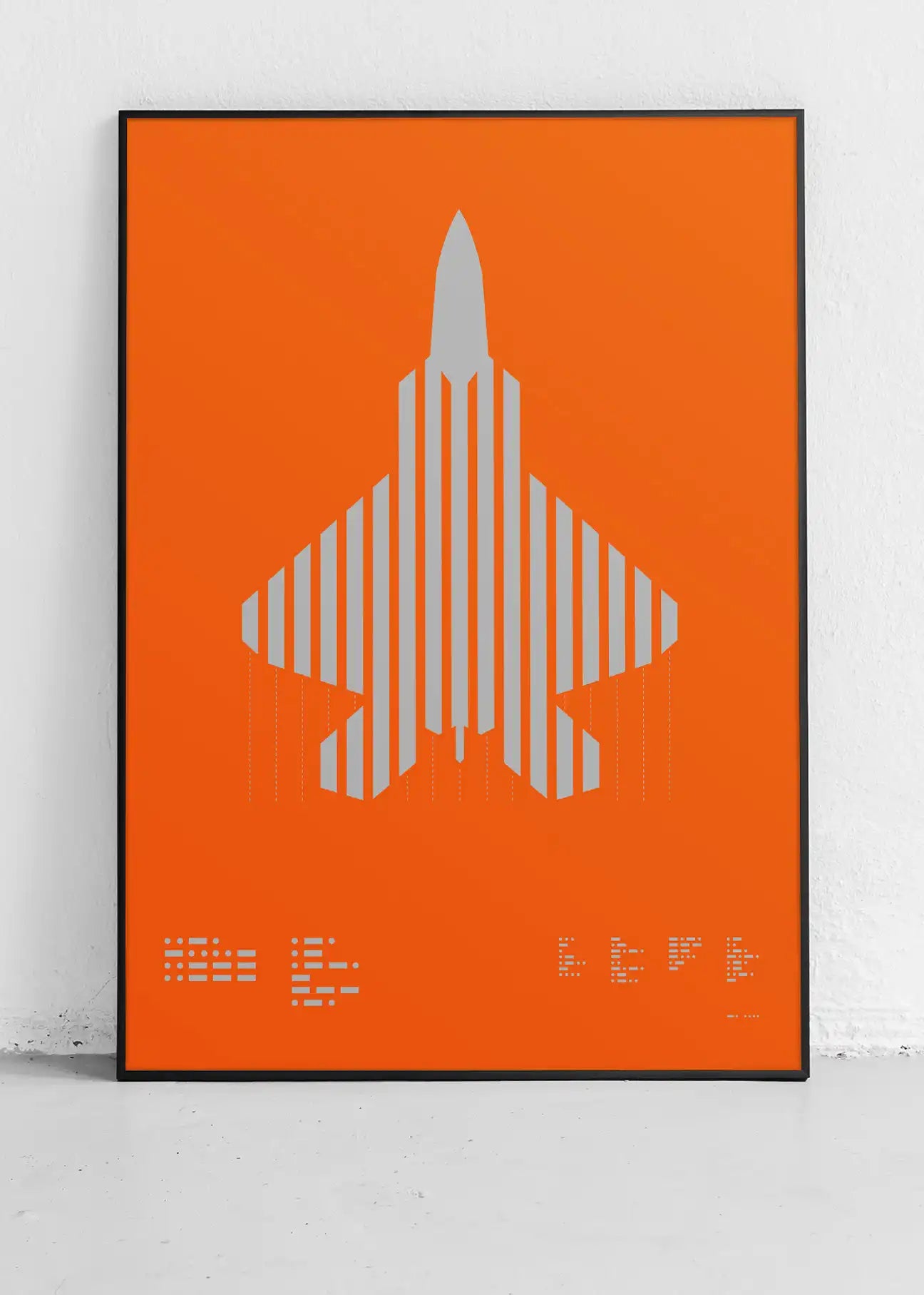 Framed minimalist artwork of the F-22 Raptor, featuring bold graphic lines and Morse code typography. Screenprinted in metallic silver ink, displayed in a modern home office setting.