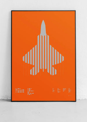 Framed minimalist artwork of the F-22 Raptor, featuring bold graphic lines and Morse code typography. Screenprinted in metallic silver ink, displayed in a modern home office setting.