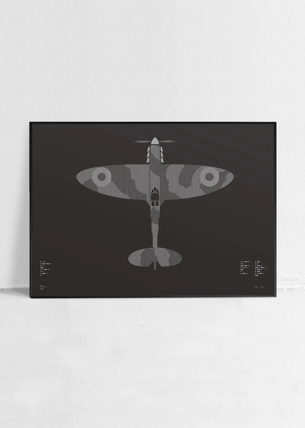 Minimalist artwork of the Spitfire aircraft, featuring bold graphic lines and Morse code typography. Screenprinted in metallic silver ink on premium Plike paper, displayed unframed in a modern home office setting.