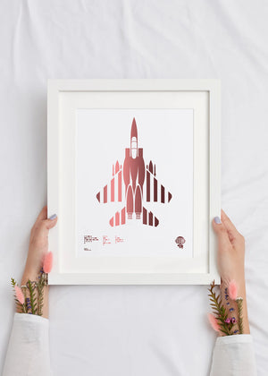 Digital foil aircraft print of the F-15E Strike Eagle air superiority fighter, rendered in rose gold foil on white digital paper, with bold aerodynamic lines. Frame not included.
