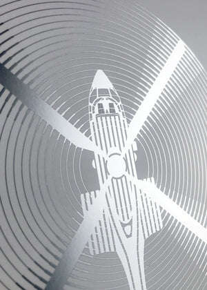 Digital foil print of the Super Puma helicopter, rendered in matt silver foil on white digital paper, with bold aerodynamic lines. Frame not included.